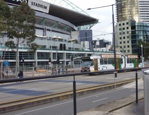 Route 75 Tram Passing Etihad Stadium Rote 75 Tram on Harbourside Esplanade With Inexpensive Cycleway in the Foreground